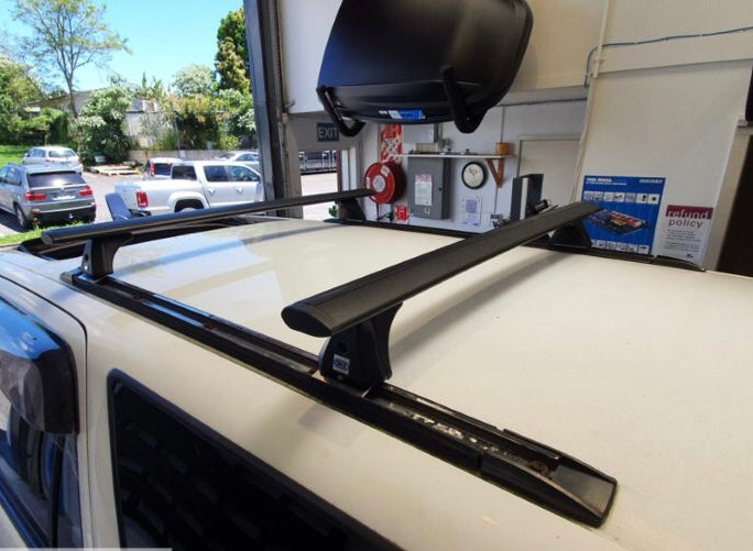 Load image into Gallery viewer, Toyota Hilux Surf with factory rails 1996-2000 CRUZ Roof Racks
