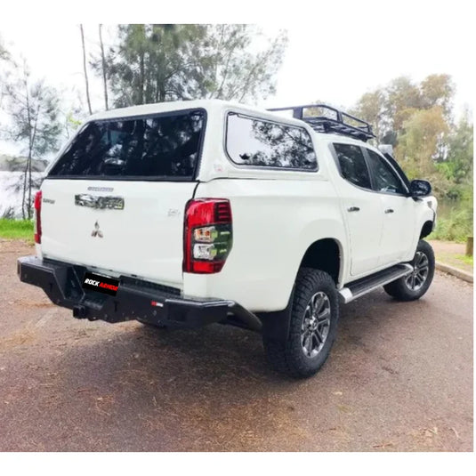 White Mitsubishi pickup truck with Rockamor Elite Steel Rear Step Towbar, rear step tow