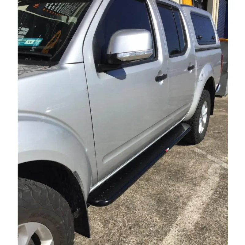Load image into Gallery viewer, Silver Nissan Navara pickup with black brush bars and premium steel Rockarmor Brushbar
