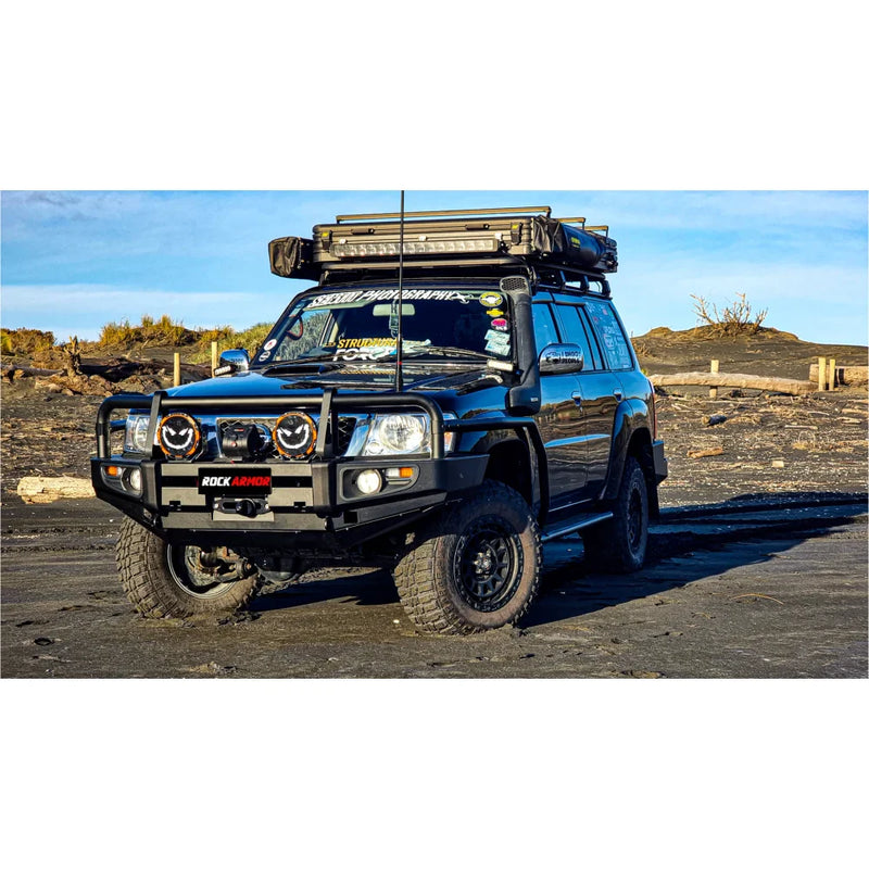 Load image into Gallery viewer, Black off-road vehicle with roof rack featuring Rockarmor Brushbar for Nissan Patrol GU1
