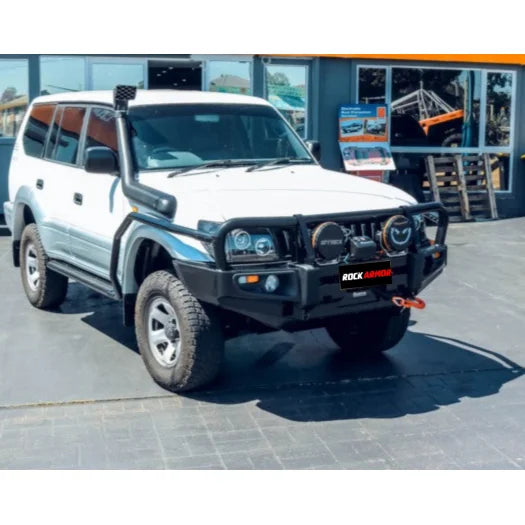 White off-road vehicle with black bull bar showcasing Rockarmor Brushbar for Toyota Prado