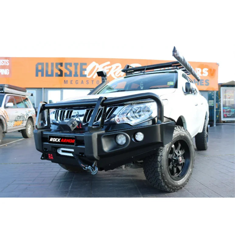 Load image into Gallery viewer, White off-road pickup truck with Rockarmor Elite Steel Bullbar and fog lights
