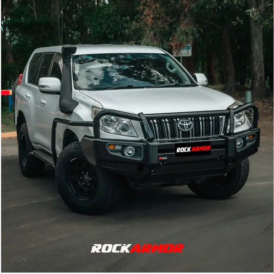 Silver off-road vehicle with black accessories featuring the Rockarmor Elite Steel Bullbar for Toyota Prado 150 2009-2013