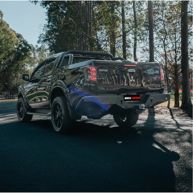 Load image into Gallery viewer, Black Mitsubishi Triton pickup truck with Rockarmor Elite Steel Rear Step Tow Bar
