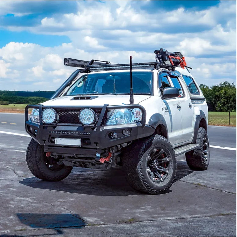 Load image into Gallery viewer, White off-road pickup truck with hoop steel bullbar for maximum frontal protection
