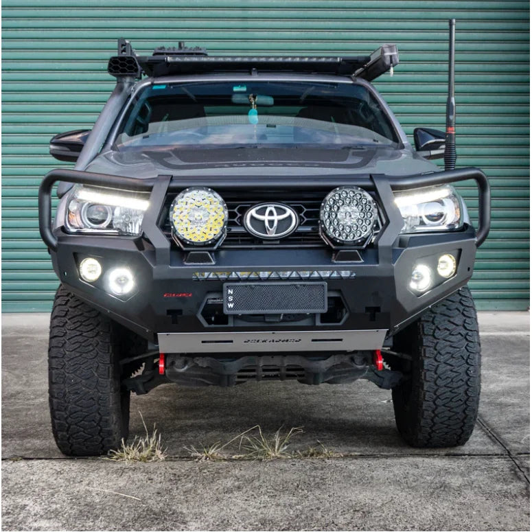 Load image into Gallery viewer, Gray Toyota Hilux with Rockarmor GT Hoop steel bull bar and aftermarket lights
