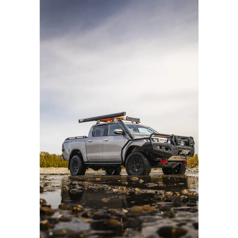Load image into Gallery viewer, Silver off-road pickup truck with Rockarmor GT Hoop Steel Bullbar on Toyota Hilux N80
