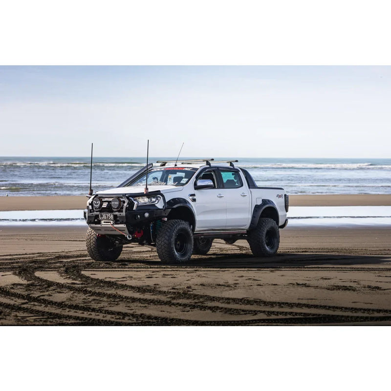 Load image into Gallery viewer, White modified pickup truck with hoop bullbar, driving lights, and synthetic winch rope
