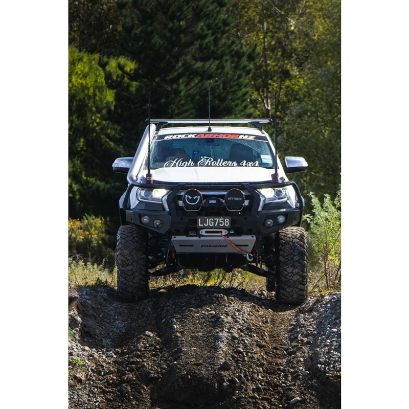 Load image into Gallery viewer, White off-road truck with hoop bullbar, driving lights, and synthetic winch rope installed
