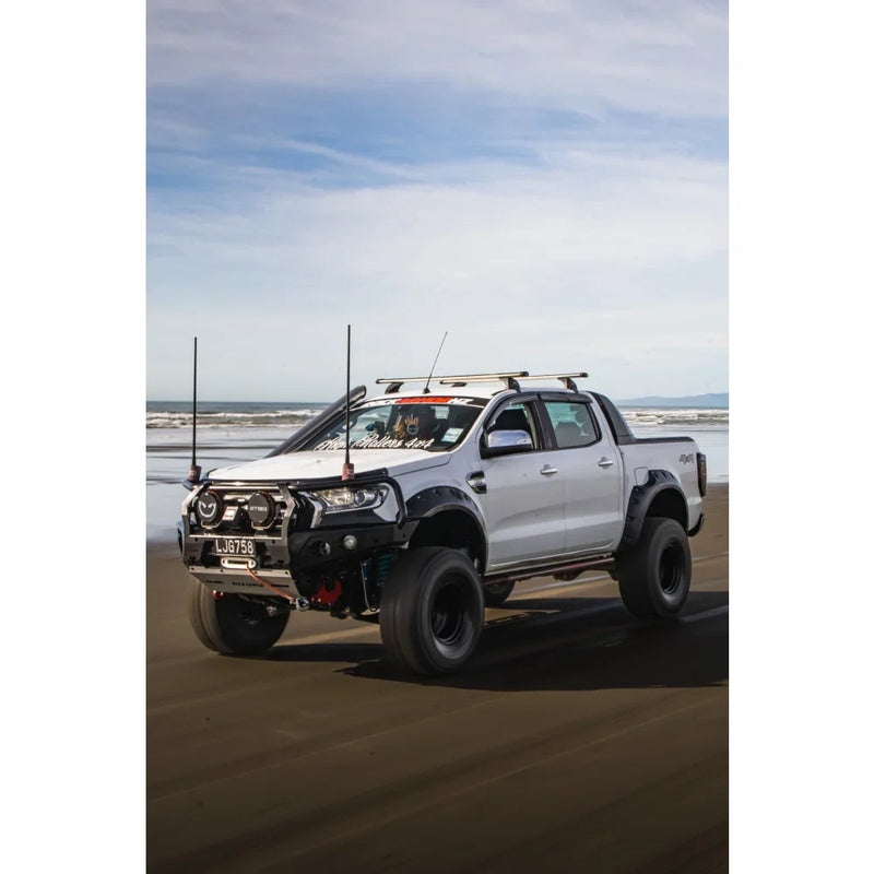 Load image into Gallery viewer, Modified white pickup truck with Rockarmor GT Steel Hoop Bullbar, driving lights, and fog lights
