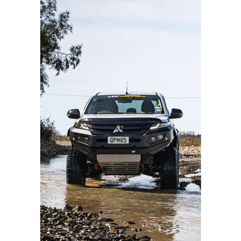 Load image into Gallery viewer, Black Mitsubishi off-road truck with Rockarmor GT Steel Bull Bar and driving lights
