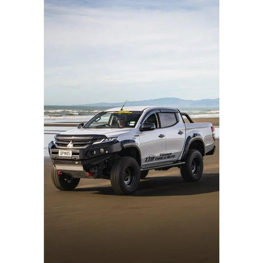 Modified white pickup truck with Rockarmor GT Steel Hoopless Bullbar and driving lights