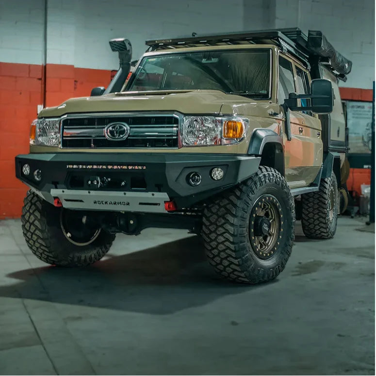 Load image into Gallery viewer, Tan Toyota Land Cruiser with off-road modifications featuring Rockarmor Gt Steel Hoopless Bullbar
