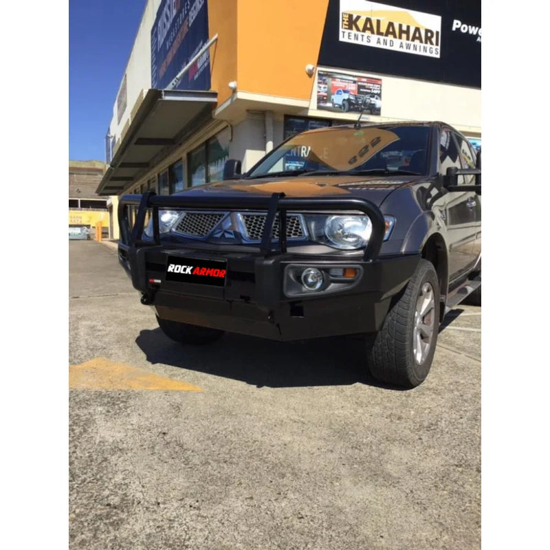 Load image into Gallery viewer, Black steel bull bar with fog light mounts on gray Mitsubishi Triton MN/ML 2006-2015
