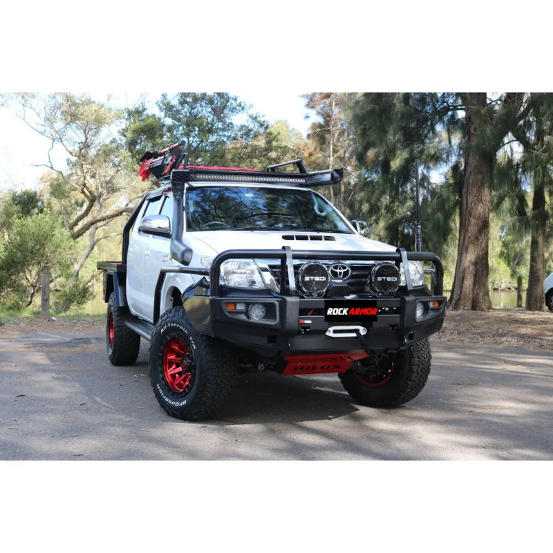 Load image into Gallery viewer, White off-road pickup truck with Rockarmor premium steel bullbar and fog lights
