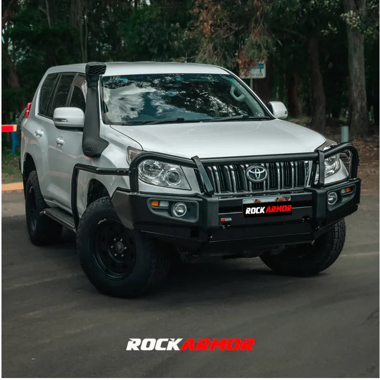 Load image into Gallery viewer, Silver off-road Toyota SUV with Rockarmor premium steel bullbar and fog lights
