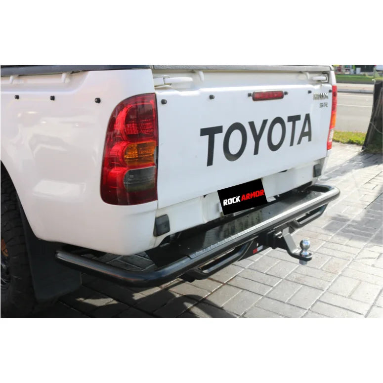 Load image into Gallery viewer, White Toyota pickup truck with Rockarmor premium steel rear step tow bar for Hilux N70

