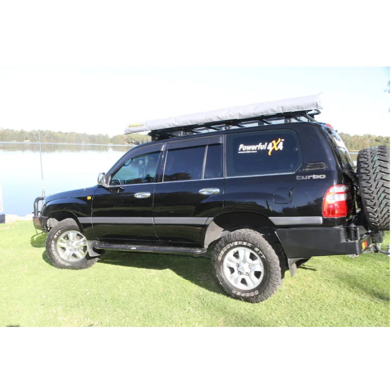 Load image into Gallery viewer, Black four-wheel-drive vehicle with Rockarmor Steel Dual Wheel Carrier for Toyota Landcruiser FJ105
