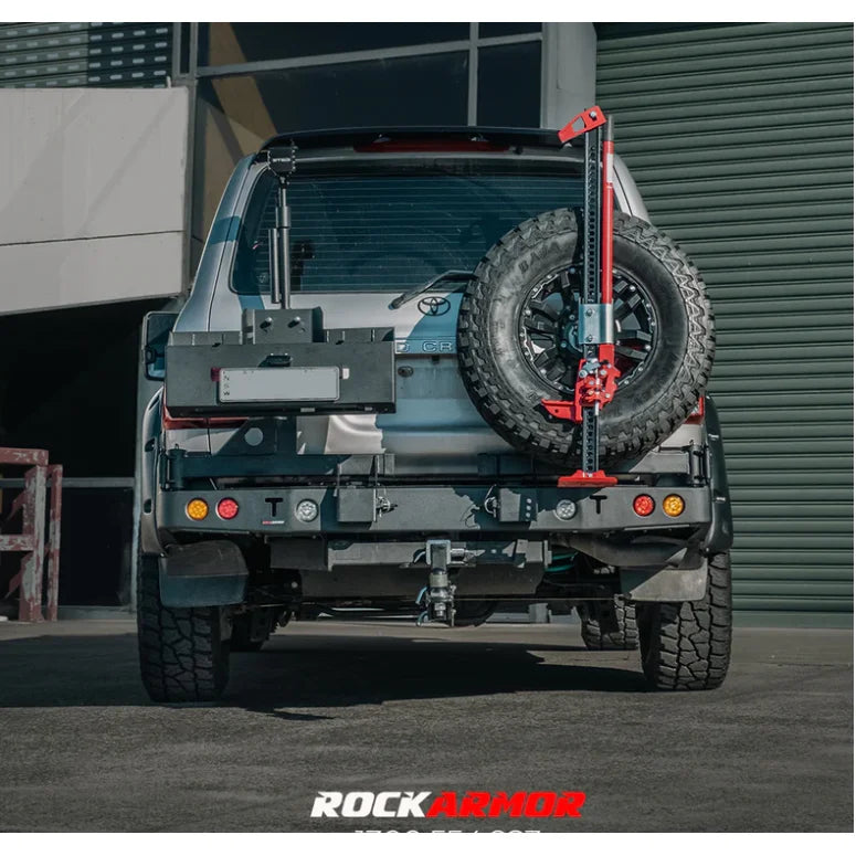 Load image into Gallery viewer, Silver truck with spare wheel and jack, featuring Rockarmor steel wheel carrier fitting video
