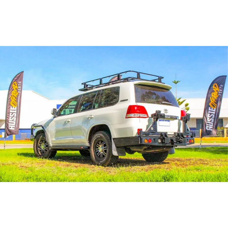 Load image into Gallery viewer, White off-road SUV with roof rack displaying Rockarmor Steel Dual Wheel Carrier for Toyota Landcruiser Fj200

