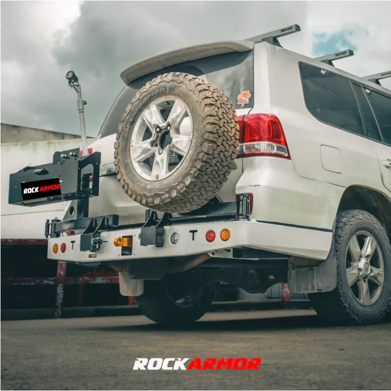 Load image into Gallery viewer, White SUV with spare wheel mounted on rear bar using Rockarmor Steel Dual Wheel Carrier
