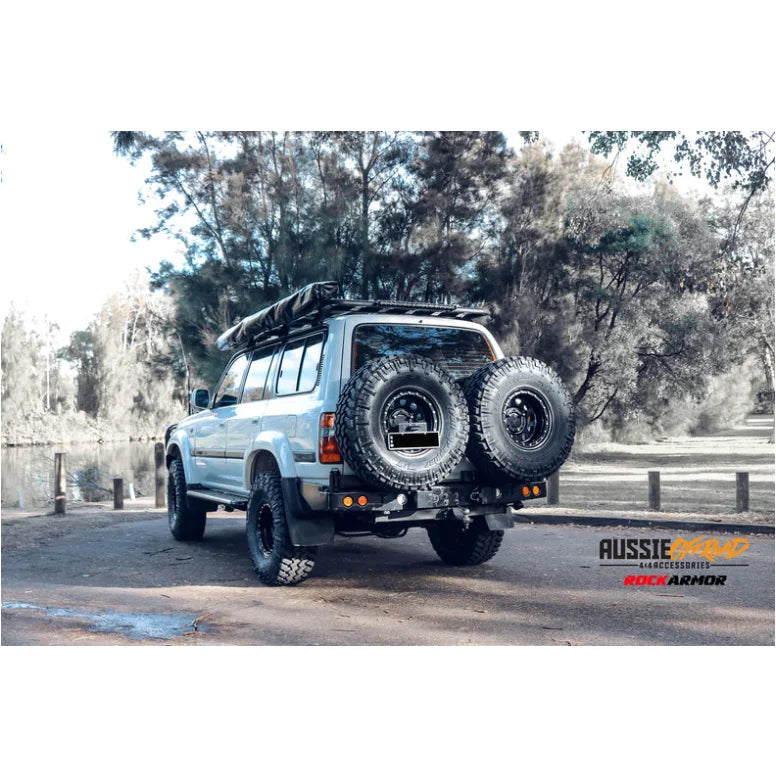 Load image into Gallery viewer, Off-road vehicle with Rockarmor Steel Dual Wheel Carrier and dual spare wheels for Toyota Landcruiser Fj80 1992-1997 with fitting video
