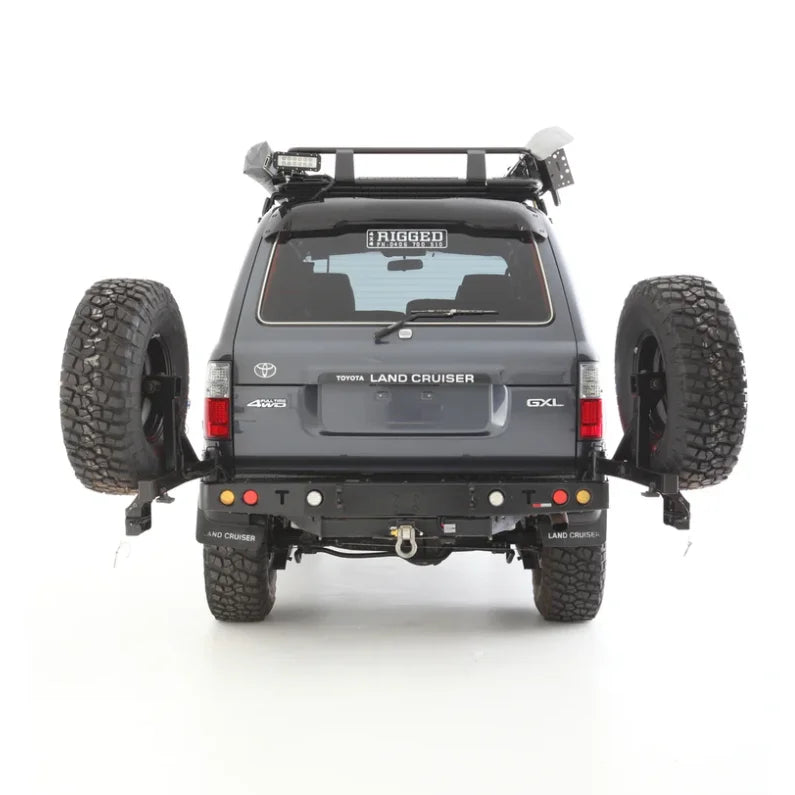 Load image into Gallery viewer, Gray Toyota Land Cruiser with dual spare wheels and Rockarmor steel wheel carrier
