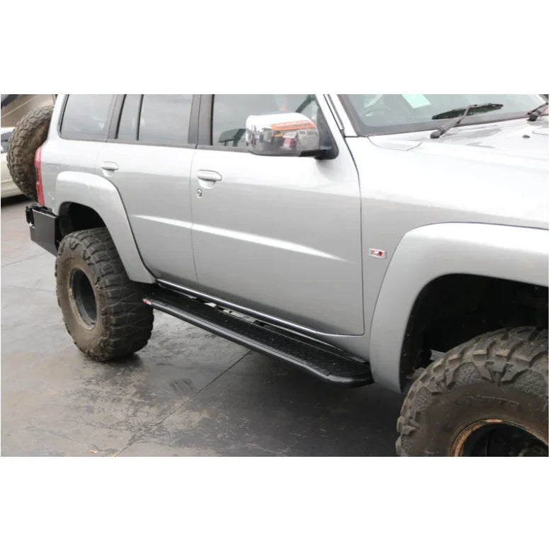 Load image into Gallery viewer, Silver off-road vehicle with steel checker plate Rockarmor Steel Rockslider side steps for Nissan Patrol Y61 GU1 GU4 1998 to current
