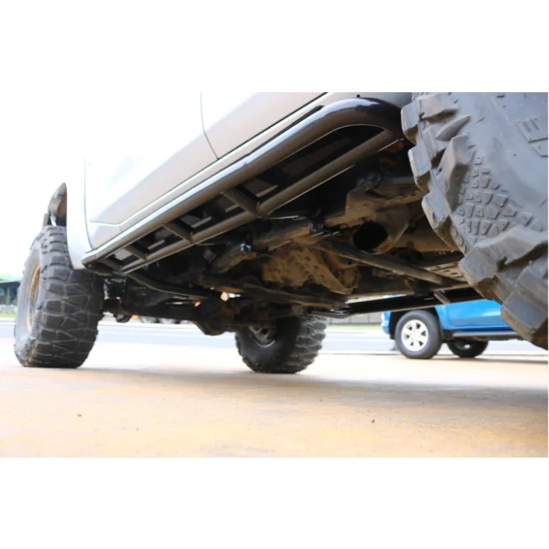 Load image into Gallery viewer, Truck undercarriage with oversized tires featuring steel checker plate side steps and fitting video
