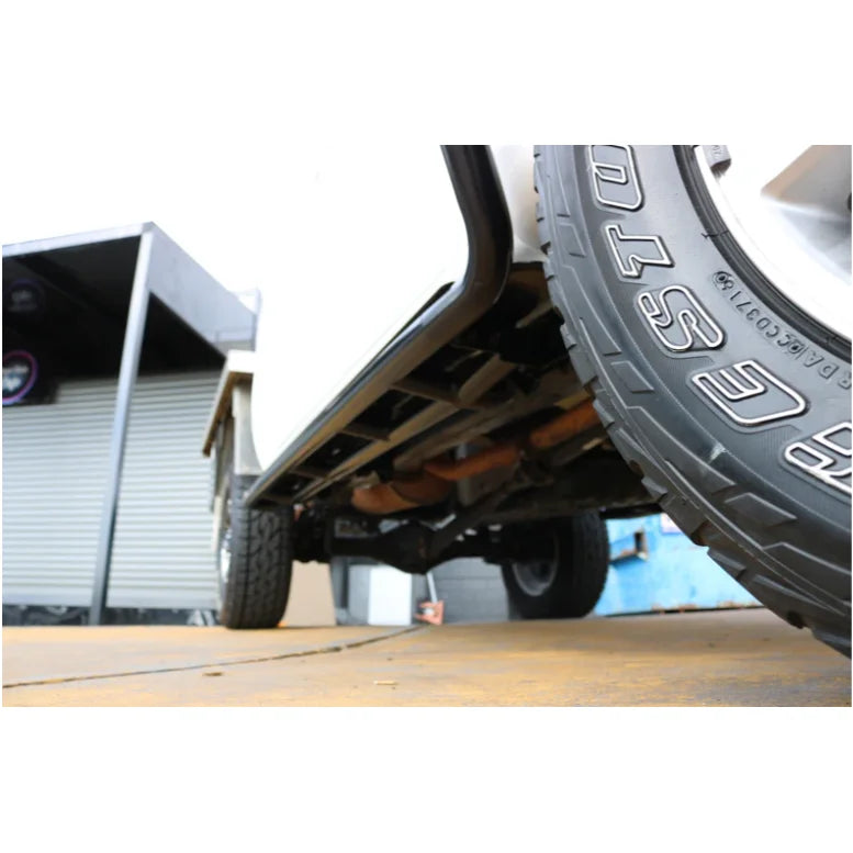 Load image into Gallery viewer, Vehicle undercarriage with steel checker plate, showing Rockarmor Steel Rockslider fitting video
