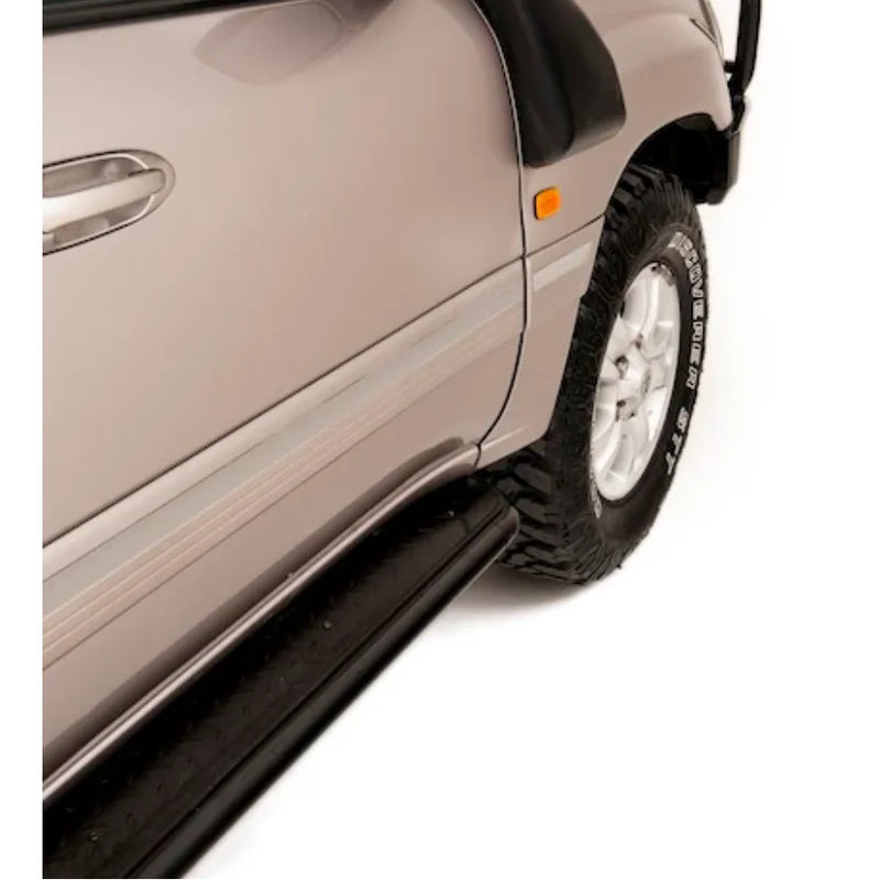 Load image into Gallery viewer, Silver SUV side view with Rockarmor Steel Rockslider side steps on Toyota Landcruiser FJ100
