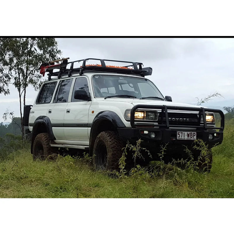 Load image into Gallery viewer, White Toyota Land Cruiser with roof rack and steel checker plate Rockslider side steps
