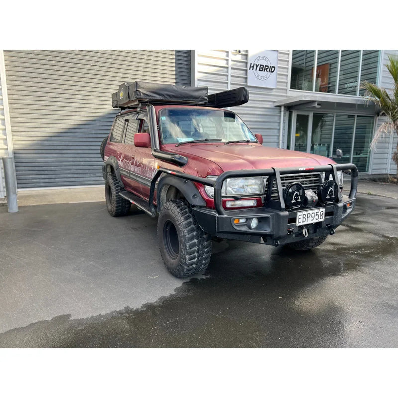 Load image into Gallery viewer, Maroon off-road vehicle with steel checker plate Rockarmor Steel Rockslider side steps for Toyota Landcruiser Fj80
